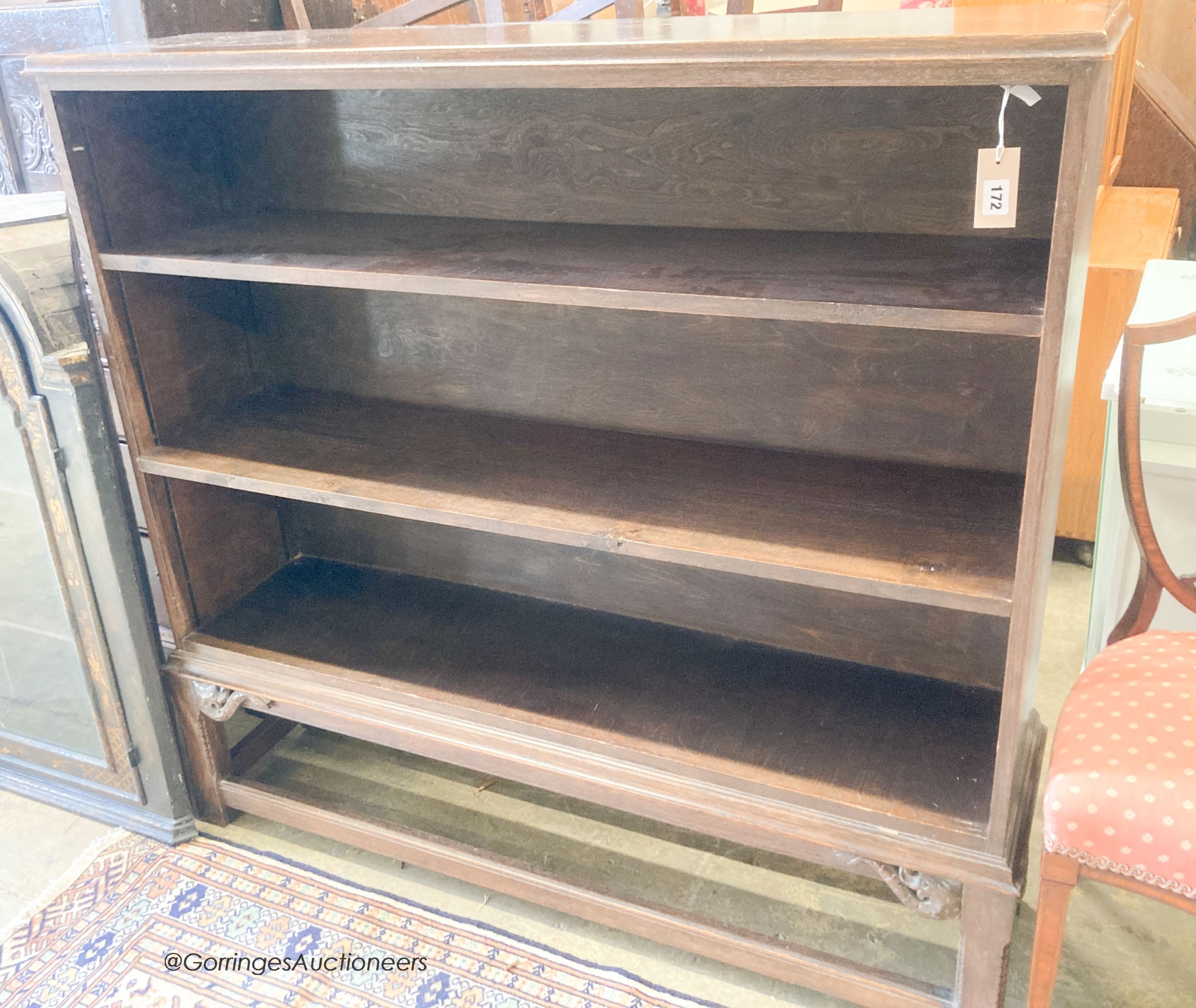 A 1920's oak open bookcase, length 126cm, depth 32cm, height 122cm